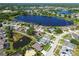 Aerial view of community with attractive homes surrounding a beautiful lake at 22431 Willow Lakes Dr, Lutz, FL 33549