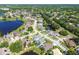 Community aerial showcasing homes surrounding a waterway and lush greenery at 22431 Willow Lakes Dr, Lutz, FL 33549