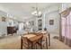 Open dining area featuring a chandelier and easy access to living room and bedrooms at 22431 Willow Lakes Dr, Lutz, FL 33549