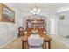 Elegant dining room with a chandelier, a large china cabinet, and neutral wall color at 22431 Willow Lakes Dr, Lutz, FL 33549