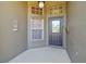 Charming covered entry featuring a decorative door and sidelight at 22431 Willow Lakes Dr, Lutz, FL 33549