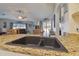 Kitchen sink with granite countertops and a view into the living room area at 22431 Willow Lakes Dr, Lutz, FL 33549