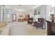 Comfortable living room boasts neutral tones, fireplace, and adjacent dining area, perfect for gatherings at 22431 Willow Lakes Dr, Lutz, FL 33549