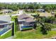 Aerial view of screened pool and landscaped backyard in residential neighborhood at 22431 Willow Lakes Dr, Lutz, FL 33549
