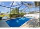 Inviting backyard pool and screened enclosure with mature landscaping and lake views at 22431 Willow Lakes Dr, Lutz, FL 33549