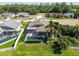Aerial view of a screened pool and landscaped backyard in a serene residential neighborhood at 22431 Willow Lakes Dr, Lutz, FL 33549