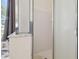 Enclosed shower with glass doors is alongside marble topped vanity in bathroom at 22431 Willow Lakes Dr, Lutz, FL 33549
