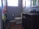 Bathroom with dark vanity and granite countertop at 3207 Jarvis St, Holiday, FL 34690