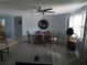 Inviting dining area with hardwood floors, classic furniture, and ample natural light at 3207 Jarvis St, Holiday, FL 34690