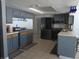 Updated kitchen featuring modern appliances, stylish cabinetry, and tile flooring at 3207 Jarvis St, Holiday, FL 34690