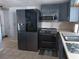 Updated kitchen showcasing stainless steel appliances, sleek cabinetry, and modern fixtures at 3207 Jarvis St, Holiday, FL 34690