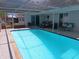 Sparkling swimming pool with outdoor furniture at 3207 Jarvis St, Holiday, FL 34690