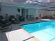 Sparkling swimming pool with covered patio at 3207 Jarvis St, Holiday, FL 34690