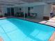 Sparkling swimming pool with patio furniture at 3207 Jarvis St, Holiday, FL 34690