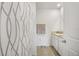 Clean bathroom with a shower, vanity, and a white and gray color palette at 33592 Barberry Leaf Way, Wesley Chapel, FL 33543