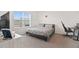 Cozy bedroom with a queen-size bed, large window, and a dedicated workspace at 33592 Barberry Leaf Way, Wesley Chapel, FL 33543