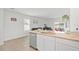 Kitchen with granite countertop island, stainless steel appliances and open floorplan at 33592 Barberry Leaf Way, Wesley Chapel, FL 33543