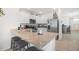 Kitchen with granite countertops, stainless steel appliances, and barstool seating at 33592 Barberry Leaf Way, Wesley Chapel, FL 33543