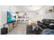 Inviting living room and kitchen area with modern furnishings and an open-concept design at 33592 Barberry Leaf Way, Wesley Chapel, FL 33543
