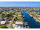Breathtaking aerial view of the waterfront home surrounded by canals, docks, and lush landscaping at 3546 Flamingo Blvd, Hernando Beach, FL 34607