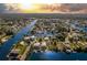 Expansive aerial view of waterfront homes, canals, and lush greenery at 3546 Flamingo Blvd at 3546 Flamingo Blvd, Hernando Beach, FL 34607