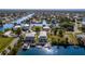 Beautiful aerial view of waterfront home with boat docks and lift, nestled along tranquil canals at 3546 Flamingo Blvd, Hernando Beach, FL 34607