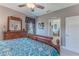 Bedroom showcasing a decorative bed, wooden dresser with mirror, and access to an adjoining bathroom at 3546 Flamingo Blvd, Hernando Beach, FL 34607