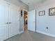 Bedroom entrance with double doors, a light gray color scheme and carpet flooring at 3546 Flamingo Blvd, Hernando Beach, FL 34607