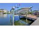 Modern boat lift and dock, providing convenient and secure access to beautiful canal waters at 3546 Flamingo Blvd, Hernando Beach, FL 34607