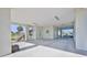 Expansive covered parking area with coastal decor, leading to staircase and views of the surrounding area at 3546 Flamingo Blvd, Hernando Beach, FL 34607