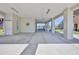 Spacious covered parking area with high ceilings, coastal-themed décor, and ample room for vehicles at 3546 Flamingo Blvd, Hernando Beach, FL 34607
