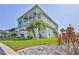 Charming two-story waterfront home with lush landscaping, a spacious balcony, and canal access at 3546 Flamingo Blvd, Hernando Beach, FL 34607