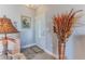 Inviting foyer with elegant decor, including a decorative vase, painting, and stylish lighting at 3546 Flamingo Blvd, Hernando Beach, FL 34607