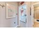 Hallway view into bedroom and bathroom showcasing neutral walls and doorway molding at 3546 Flamingo Blvd, Hernando Beach, FL 34607
