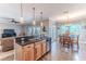 Kitchen featuring a breakfast bar that looks out into the living and dining areas at 3546 Flamingo Blvd, Hernando Beach, FL 34607