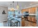 Charming kitchen with a breakfast bar, pendant lighting, and stainless steel appliances at 3546 Flamingo Blvd, Hernando Beach, FL 34607