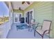 Inviting patio with coastal decor, ceiling fan, and sliding glass doors for seamless indoor/outdoor living at 3546 Flamingo Blvd, Hernando Beach, FL 34607