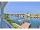 Scenic waterfront view showcasing boat dock, lift, and neighboring homes along the serene waterway at 3546 Flamingo Blvd, Hernando Beach, FL 34607