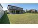Spacious backyard featuring a well-maintained lawn, ideal for recreation and relaxation at 3767 Dragonfly Trl, Odessa, FL 33556