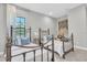 Inviting bedroom with two beds, soft pillows, and a calming color scheme, perfect for relaxation at 3767 Dragonfly Trl, Odessa, FL 33556