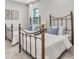 Charming bedroom featuring two beds, soft lighting, and comfortable furnishings that create a relaxing atmosphere at 3767 Dragonfly Trl, Odessa, FL 33556