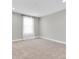 Bright, carpeted bedroom offers natural light, ready to be personalized into a cozy retreat at 3767 Dragonfly Trl, Odessa, FL 33556