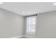 This bedroom offers natural light, neutral walls, and carpeting, a simple canvas awaiting personal touches at 3767 Dragonfly Trl, Odessa, FL 33556