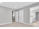 Spacious bedroom featuring neutral tones, plush carpet, and access to ensuite bathroom at 3767 Dragonfly Trl, Odessa, FL 33556