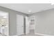 Open bedroom leading to bathroom and closet featuring neutral paint, plush carpet, and ample space at 3767 Dragonfly Trl, Odessa, FL 33556