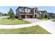 Beautifully landscaped front yard and well-maintained lawn, complemented by a paver driveway and three car garage at 3767 Dragonfly Trl, Odessa, FL 33556