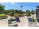Beautiful community garden with raised beds, windmill, and gravel paths at 3767 Dragonfly Trl, Odessa, FL 33556
