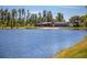 Scenic view of lake with the community center visible on the waterfront at 3767 Dragonfly Trl, Odessa, FL 33556