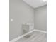 Utility sink in laundry room with gray walls and wood-look tile flooring at 3767 Dragonfly Trl, Odessa, FL 33556
