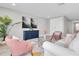 This stylish living room offers an inviting space, featuring modern decor, plush seating, and bright sunlight at 3767 Dragonfly Trl, Odessa, FL 33556